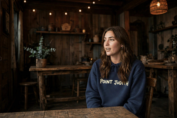 Point Judith Hoodie — in the Five Tides room, female front