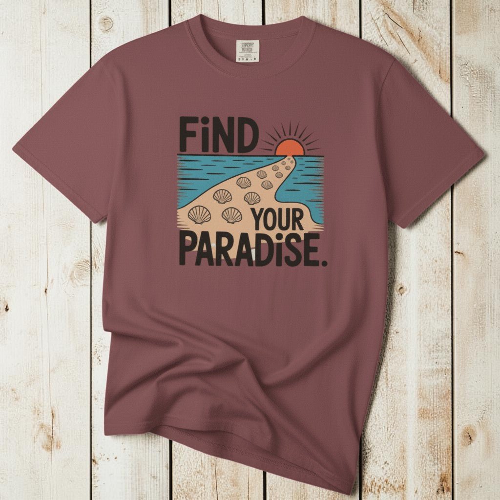 Flat lay - mauve Find Your Paradise tee with Comfort Colors label on weathered driftwood planks
