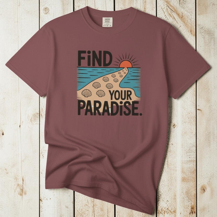 Flat lay - mauve Find Your Paradise tee with Comfort Colors label on weathered driftwood planks