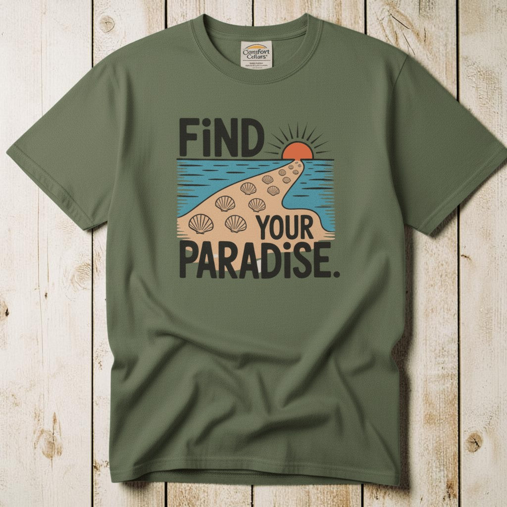 Flat lay - olive green Find Your Paradise tee with Comfort Colors label on weathered driftwood planks