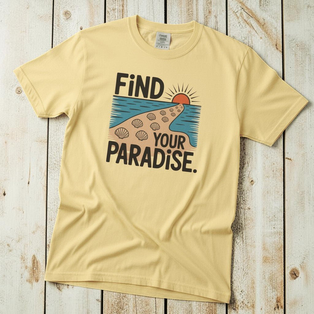 Flat lay - butter yellow Find Your Paradise tee with Comfort Colors label on weathered driftwood planks