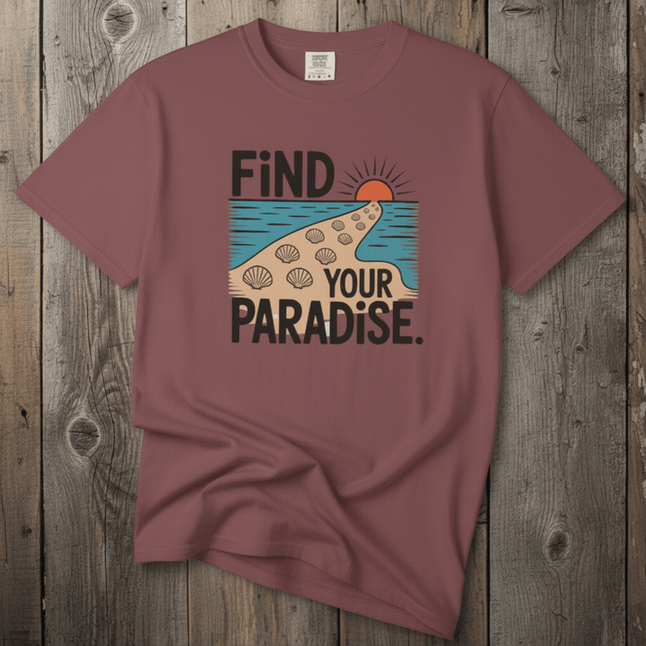 Flat lay - mauve Find Your Paradise tee with Comfort Colors label on weathered driftwood planks