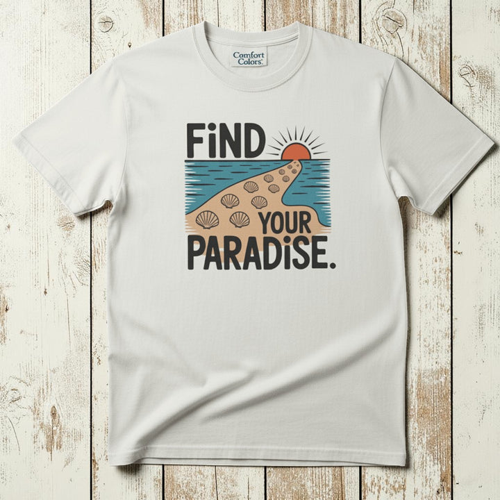 Flat lay - white Find Your Paradise tee with Comfort Colors label on weathered driftwood planks
