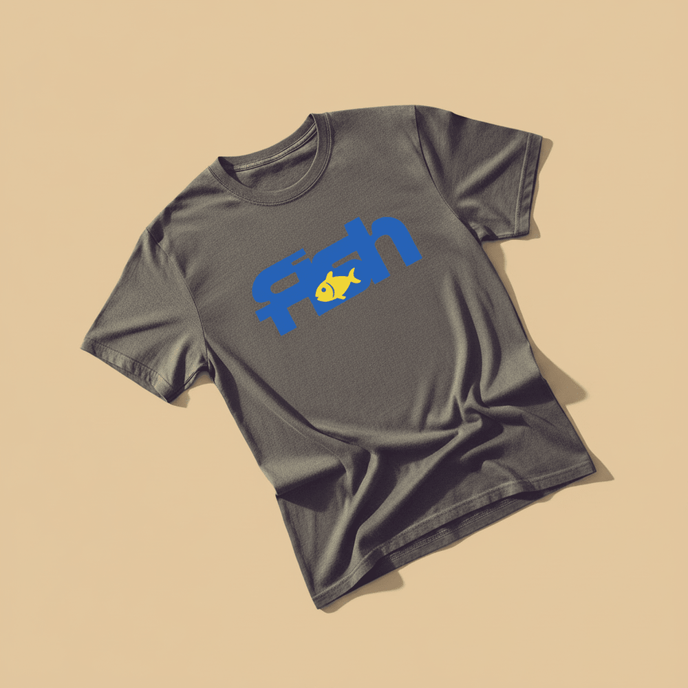 Fish Tee in Graphite — front graphic, warm sand studio background