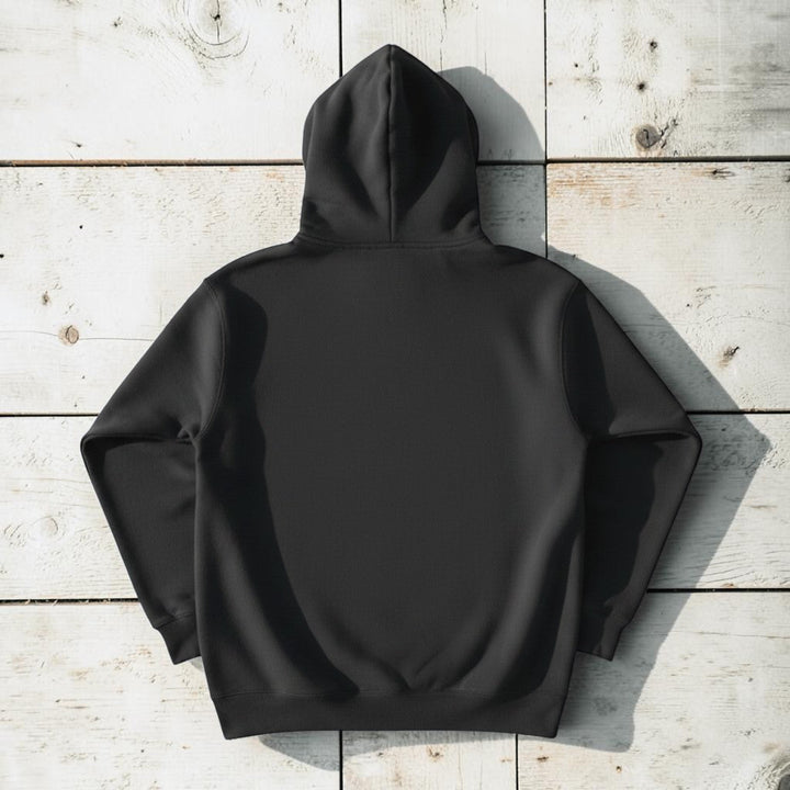 Fish Hoodie in Charcoal — plain back, warm sand studio background