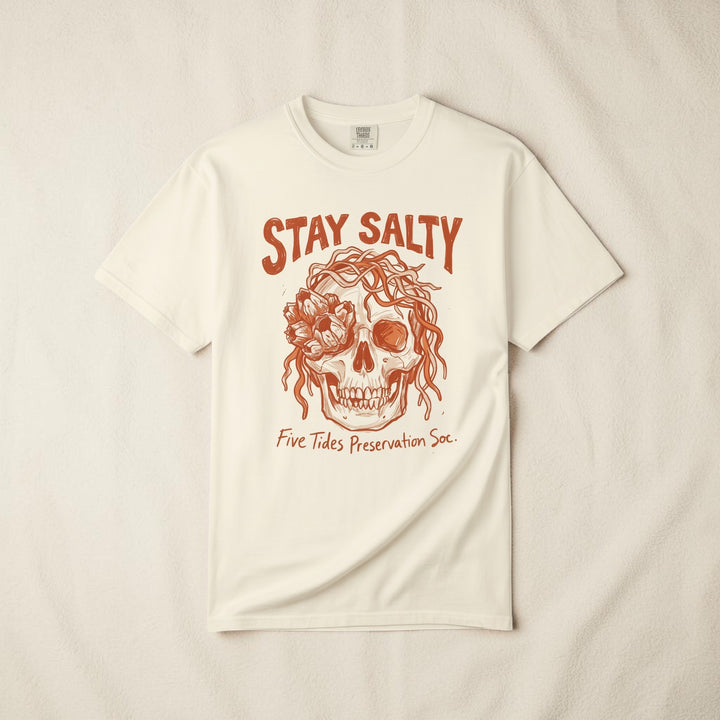 FIVE TIDES APPAREL ivory cotton t-shirt featuring a sun-faded terracotta skull graphic with rope and sea blooms.