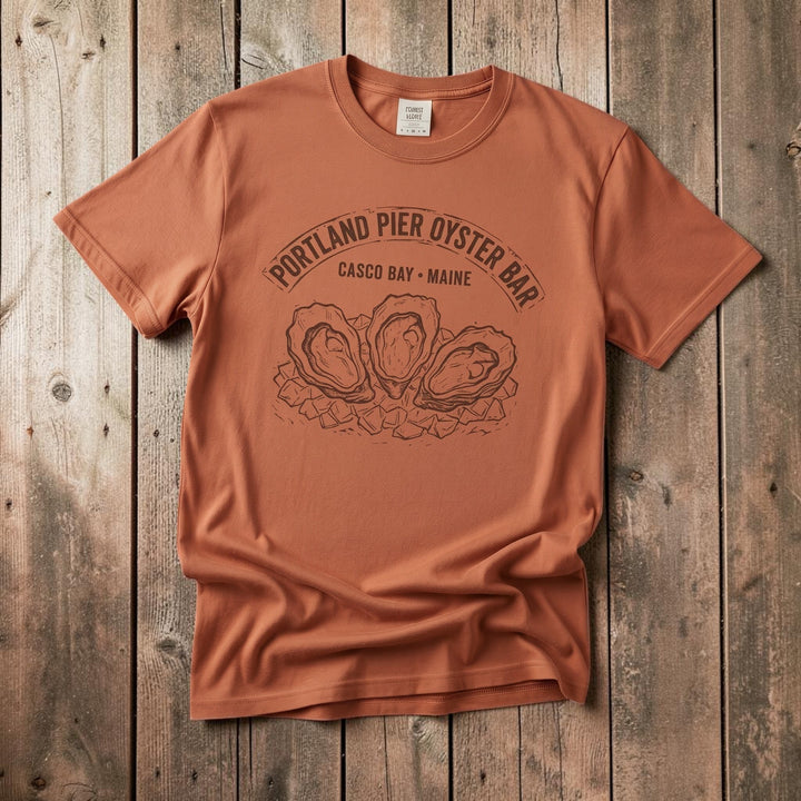 FIVE TIDES APPAREL terracotta garment-dyed cotton t-shirt featuring a vintage Portland Pier Oyster Bar graphic.