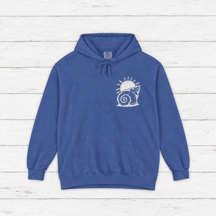 Beach Snail hoodie flat lay on whitewashed boards