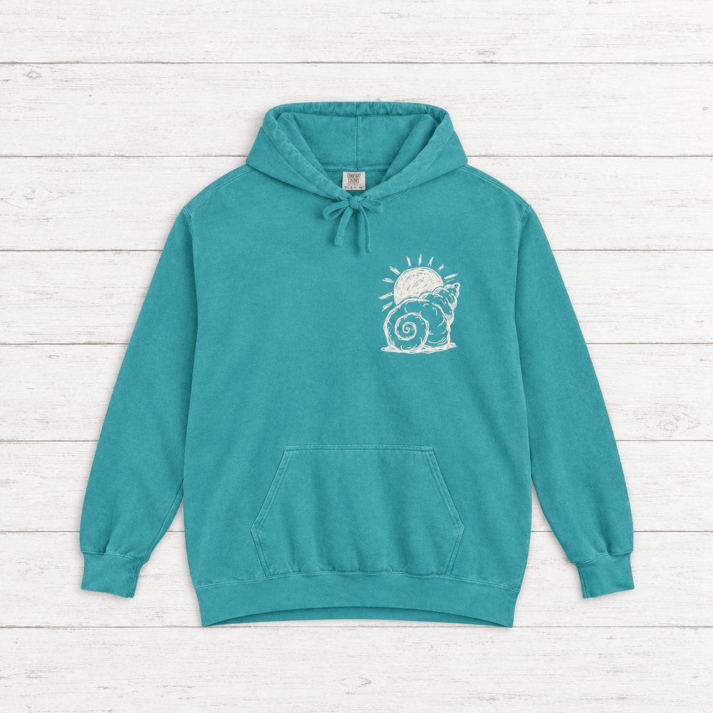 Beach Snail hoodie flat lay on whitewashed boards