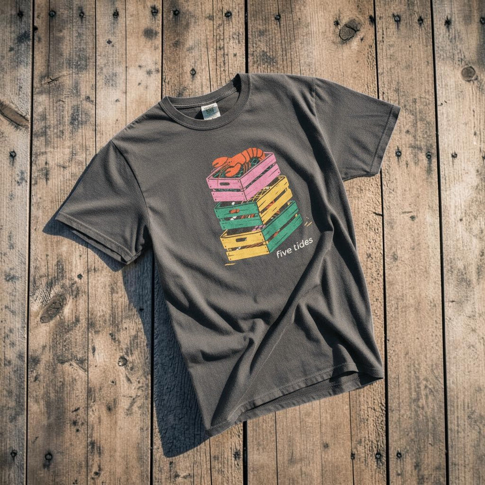 Crate Stack Lobster graphite garment-dyed tee on light cracked cement with wet marks