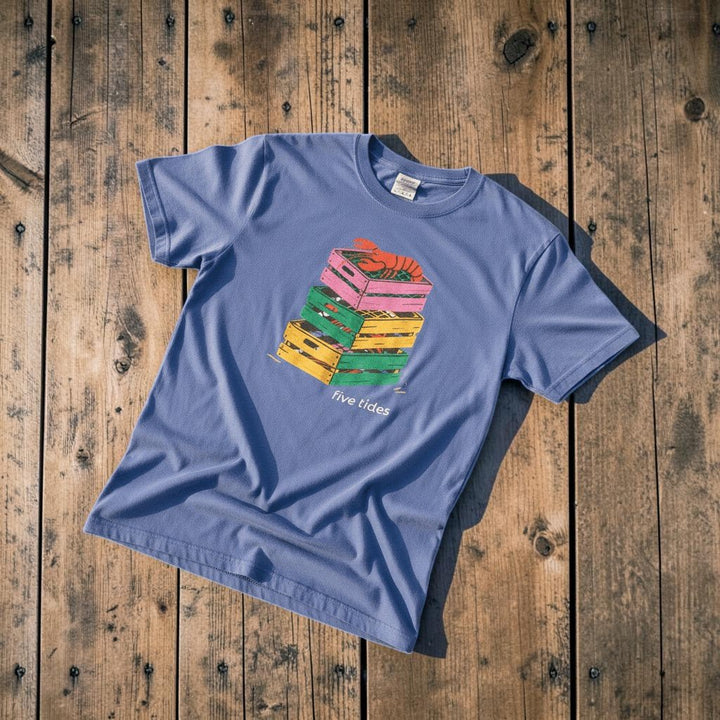 Crate Stack Lobster mystic blue garment-dyed tee on light cracked cement with wet marks