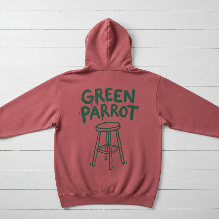 Crimson Green Parrot hoodie back flat lay on whitewashed boards