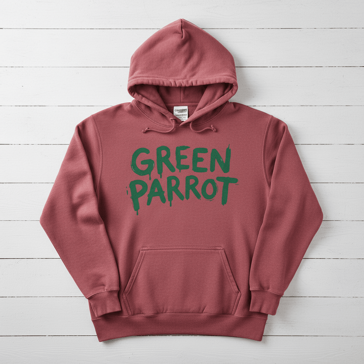 Crimson Green Parrot hoodie front flat lay on whitewashed boards