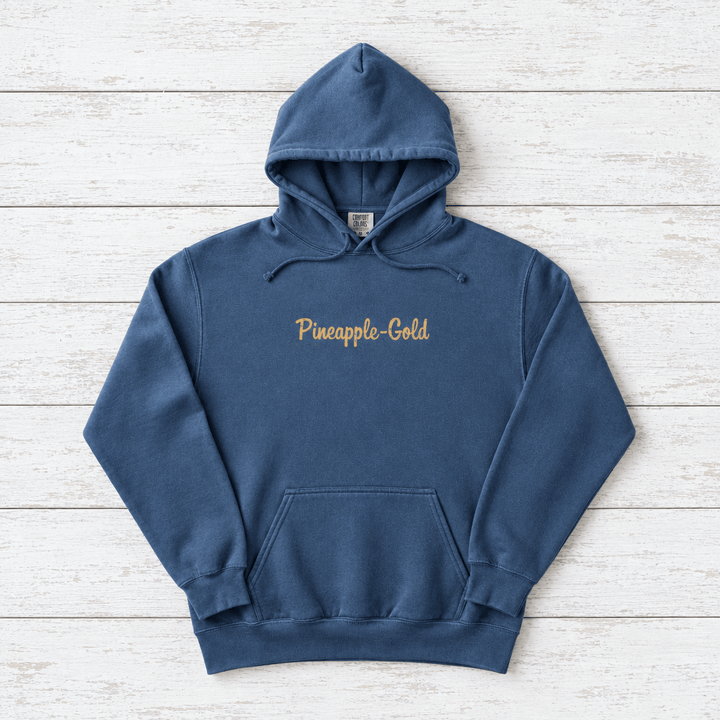 Pineapple-Gold rooster hoodie flat lay on whitewashed boards