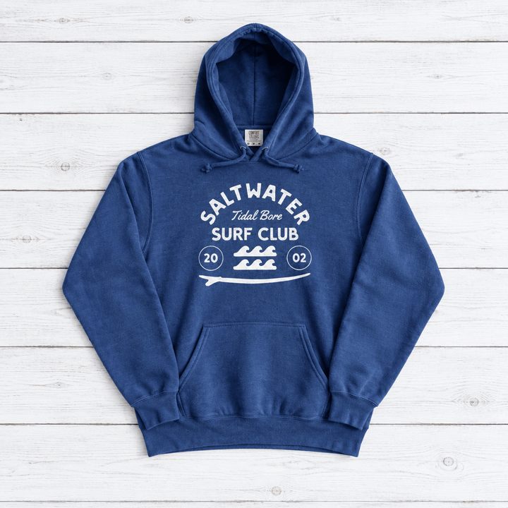 Flo Blue Saltwater Tidal Bore Surf Club hoodie front on whitewashed boards