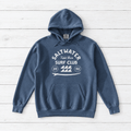 Denim Saltwater Tidal Bore Surf Club hoodie front on whitewashed boards