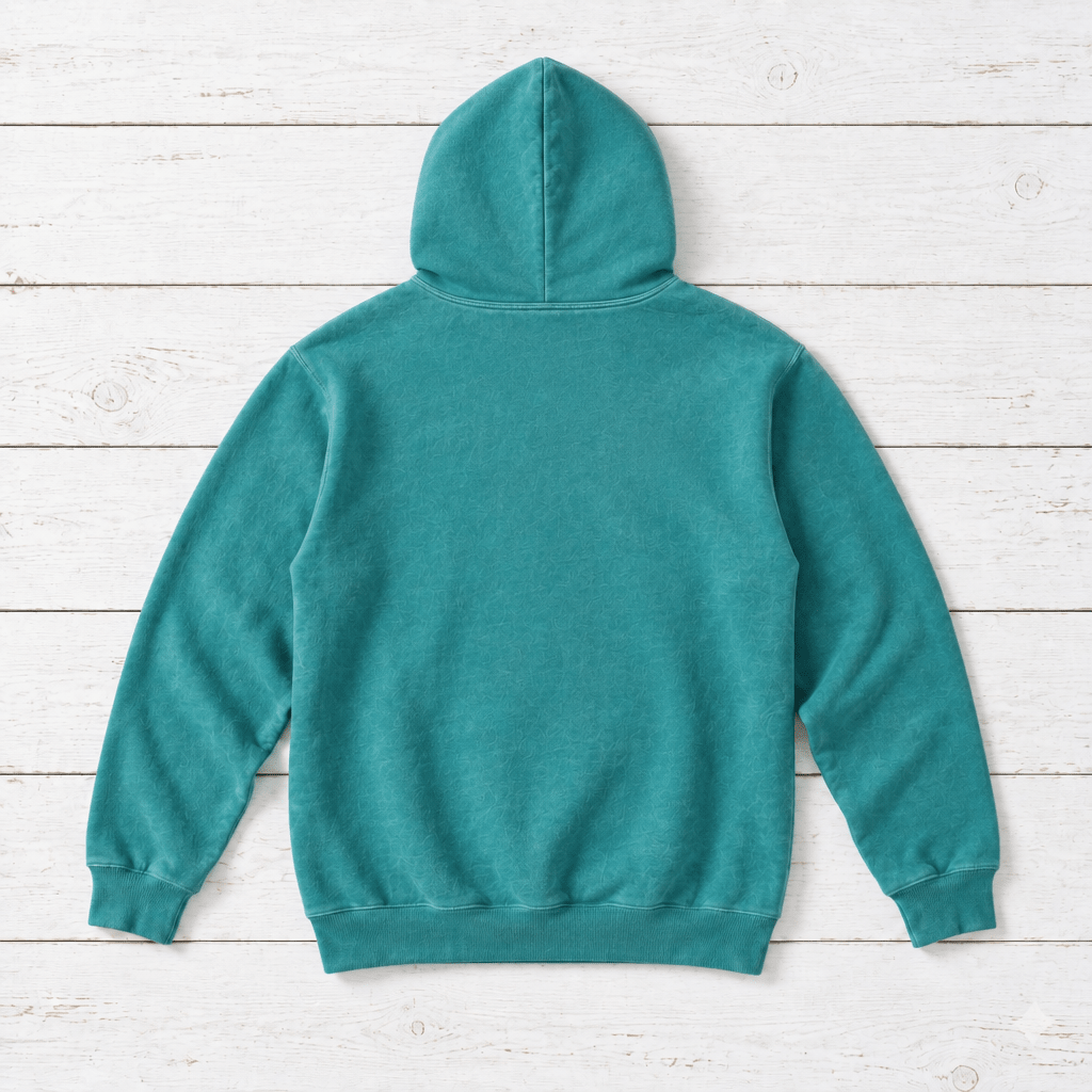 Seafoam hoodie back flat lay on whitewashed boards