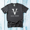 Flat lay - charcoal Five Tides V tee with Comfort Colors label on weathered driftwood planks
