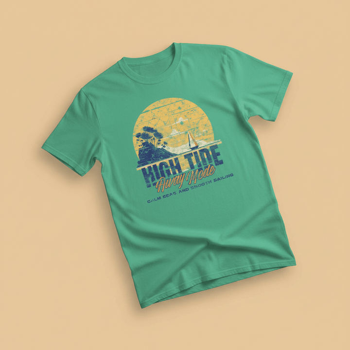 High Tide Happy Mode Tee in Seafoam Green — front graphic, warm sand studio background