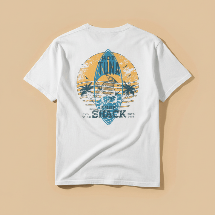 Hot Tuna Surf Shack Tee in White — full back graphic, warm sand studio background