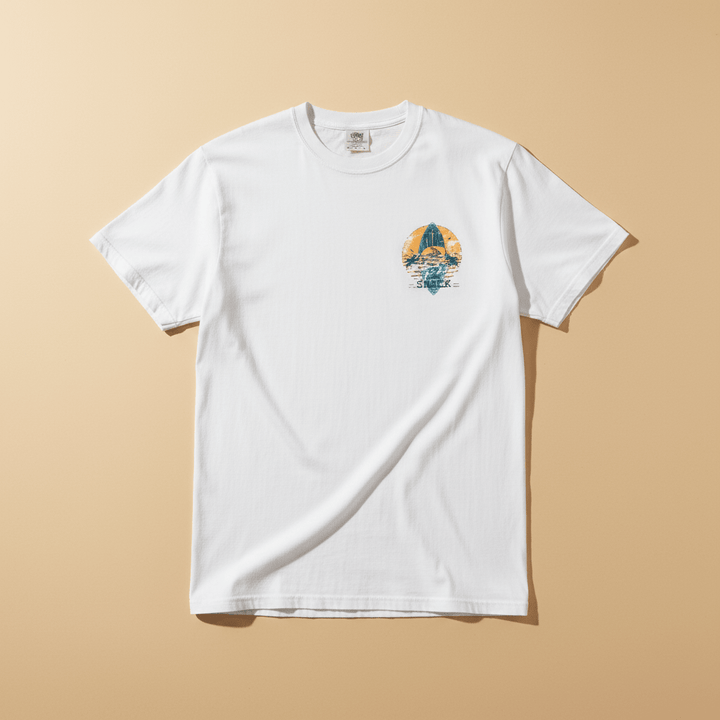 Hot Tuna Surf Shack Tee in White — front small chest graphic, warm sand studio background