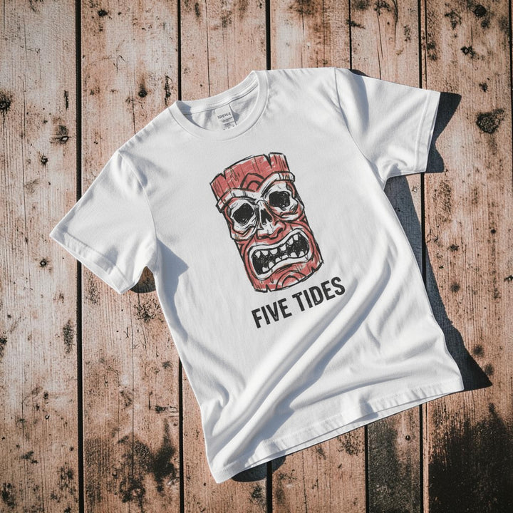 Red Tiki Skull FIVE TIDES surf graphic t-shirt in White casually tossed on a light sand-colored woven rug, coastal lifestyle product photo