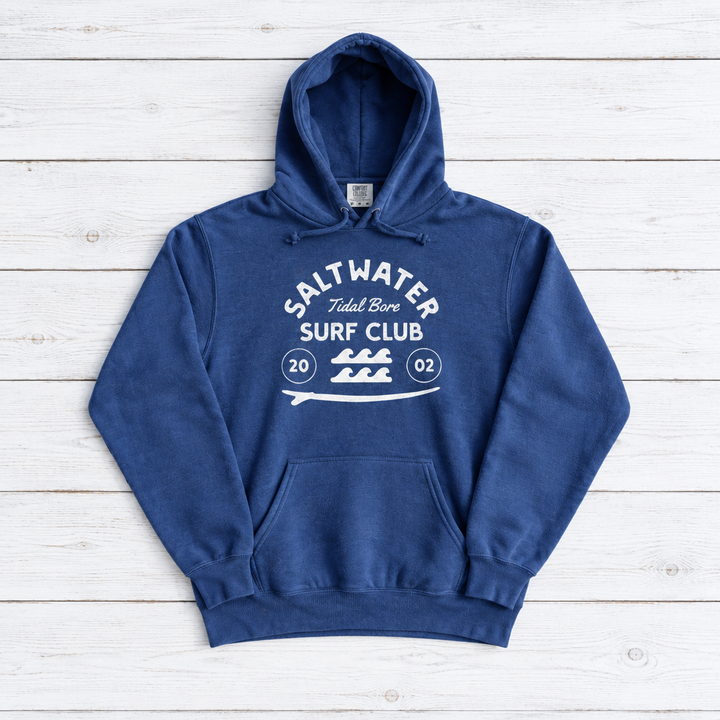 Flo Blue Saltwater Tidal Bore Surf Club hoodie front on whitewashed boards