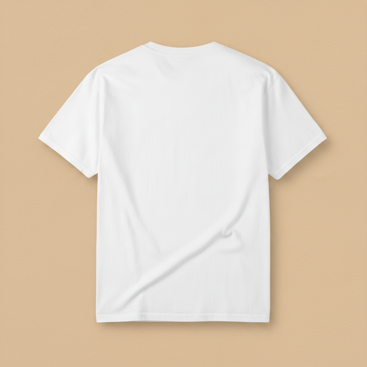 Beach Living Tee in White — plain back, warm sand studio background