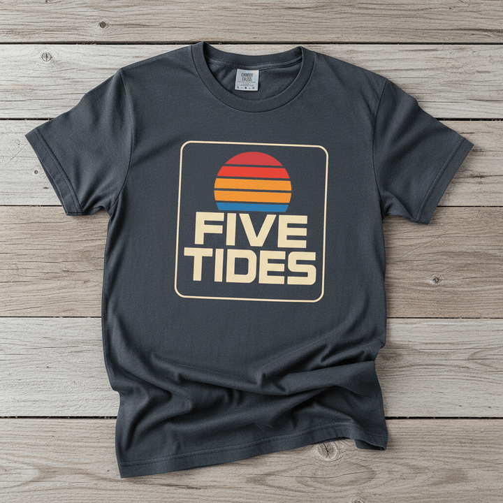 Coastal Retro Sunset graphite garment-dyed tee on faded driftwood planks