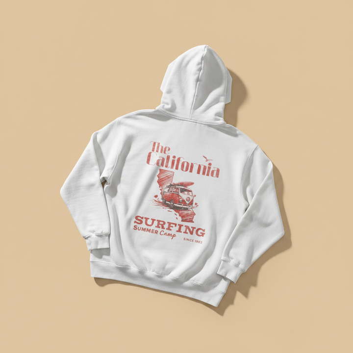 California Surfing Summer Camp Hoodie in White — back graphic, warm sand studio background