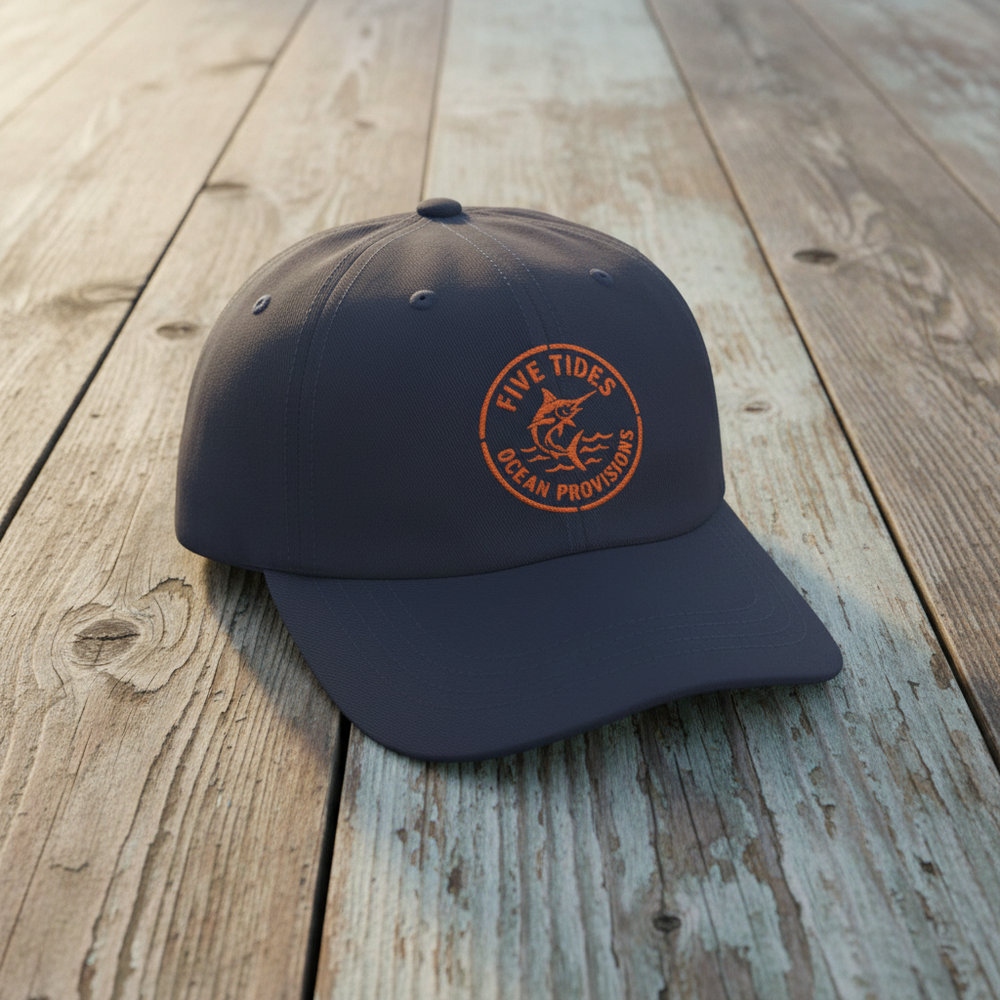 Five Tides Fisherman navy embroidered dad cap on rustic reclaimed wood