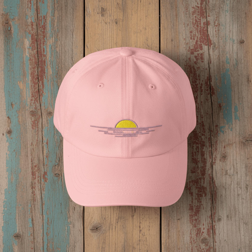 Sunrise Minimal Beach Embroidered Cap pink on faded driftwood planks