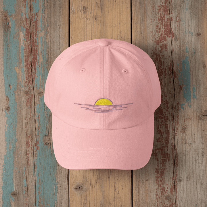Sunrise Minimal Beach Embroidered Cap pink on faded driftwood planks