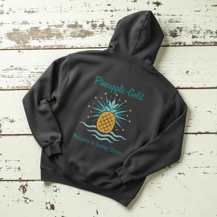 Pineapple-Gold Hoodie in Pepper — flat lay on warm sand studio background