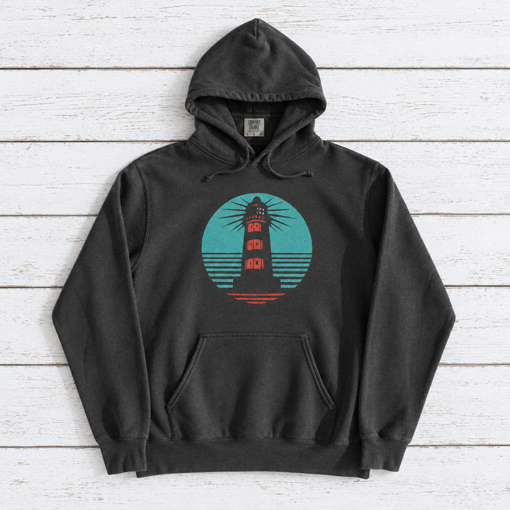 Coastal Lighthouse hoodie flat lay on whitewashed boards