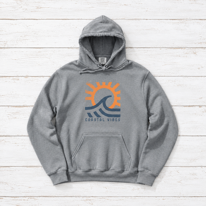 Coastal Vibes Beach hoodie flat lay on whitewashed boards