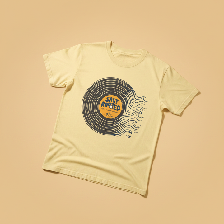 Salt Rooted Vinyl Record Tee in Banana Yellow — front graphic, warm sand studio background