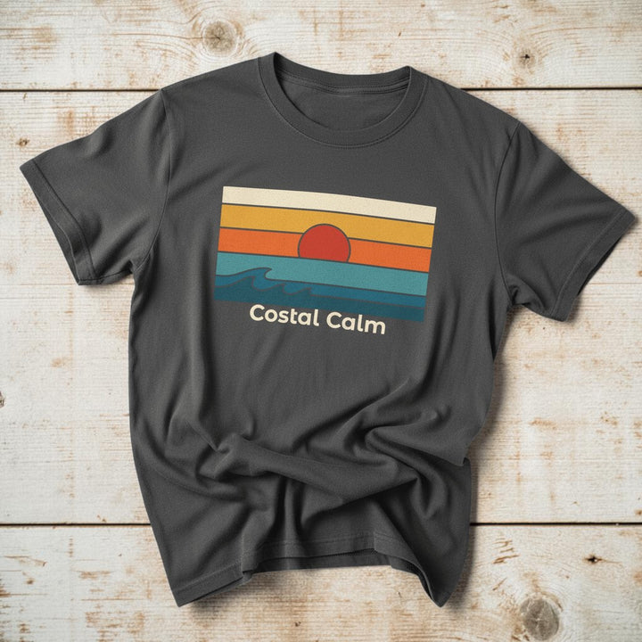 Coastal Calm Sunset Vibes graphite garment-dyed tee on faded driftwood planks