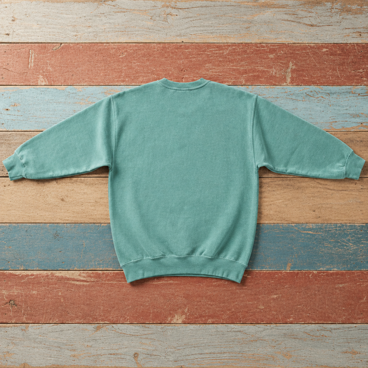 Plain back of Bar Harbor crewneck sweatshirt in Seafoam on colorful weathered driftwood boards