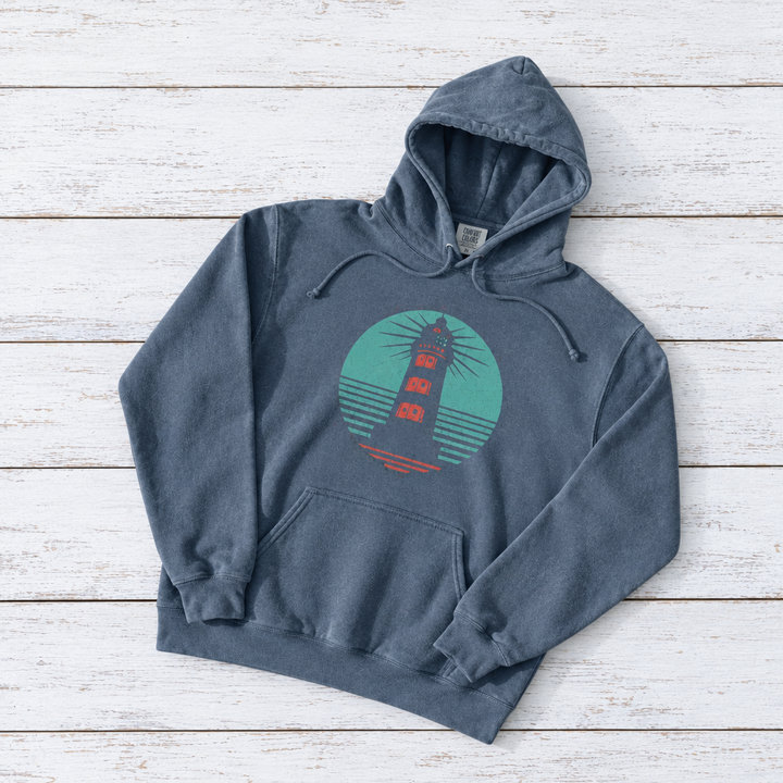 Coastal Lighthouse hoodie flat lay on whitewashed boards