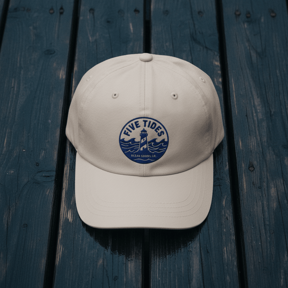 Five Tides Lighthouse Embroidered Dad Cap — Stone on Rain-Soaked Driftwood