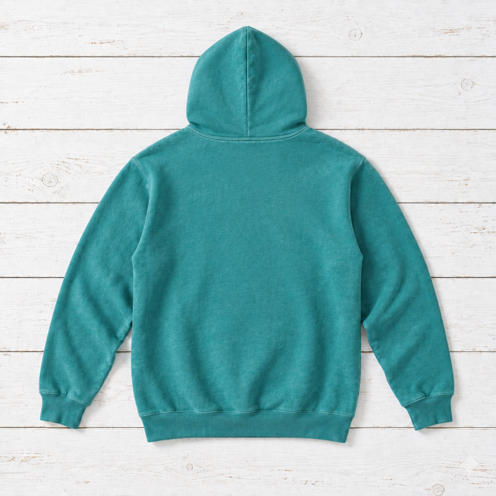 Seafoam hoodie back flat lay on whitewashed boards