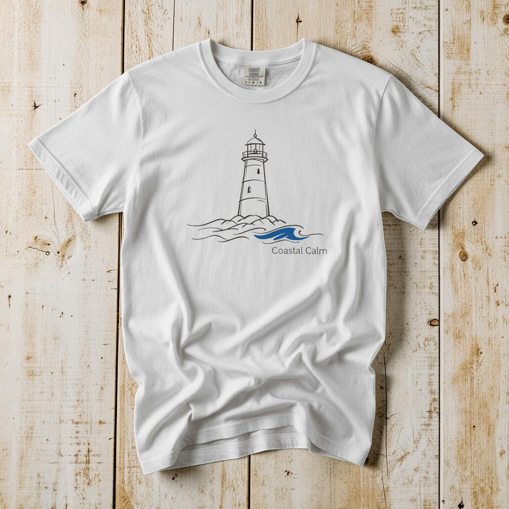Coastal Calm Lighthouse Blue Sea white garment-dyed tee on faded driftwood planks