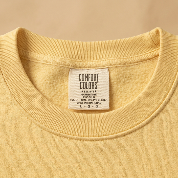 Chase The Sun yellow sweatshirt ribbed collar and Comfort Colors Honduras label detail