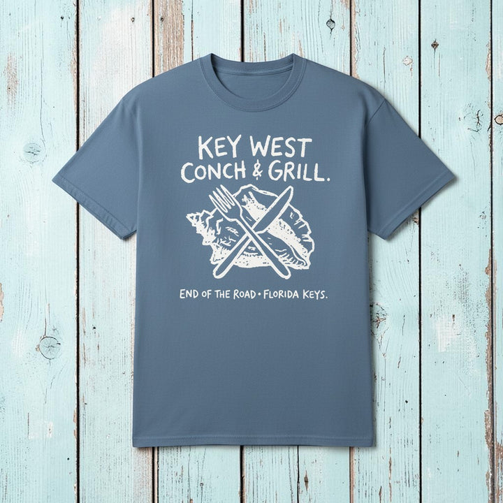 Flat lay - slate blue Key West Conch &amp; Grill tee on weathered driftwood planks