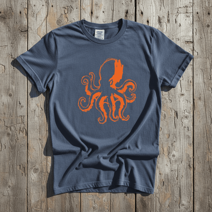 Octopus Stenciled denim garment-dyed tee casually tousled on rustic reclaimed wood