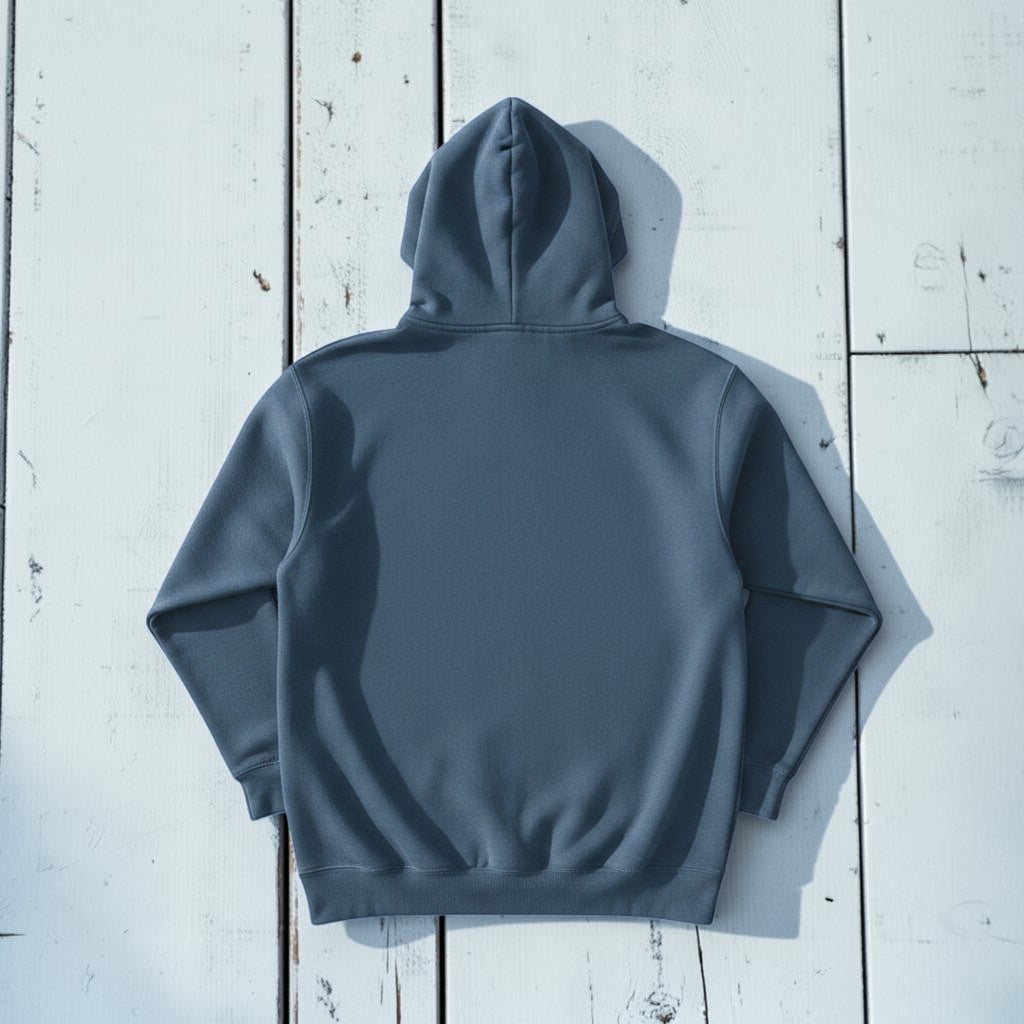 Saltwater Surf Club Hoodie in Denim — plain back, warm sand studio background