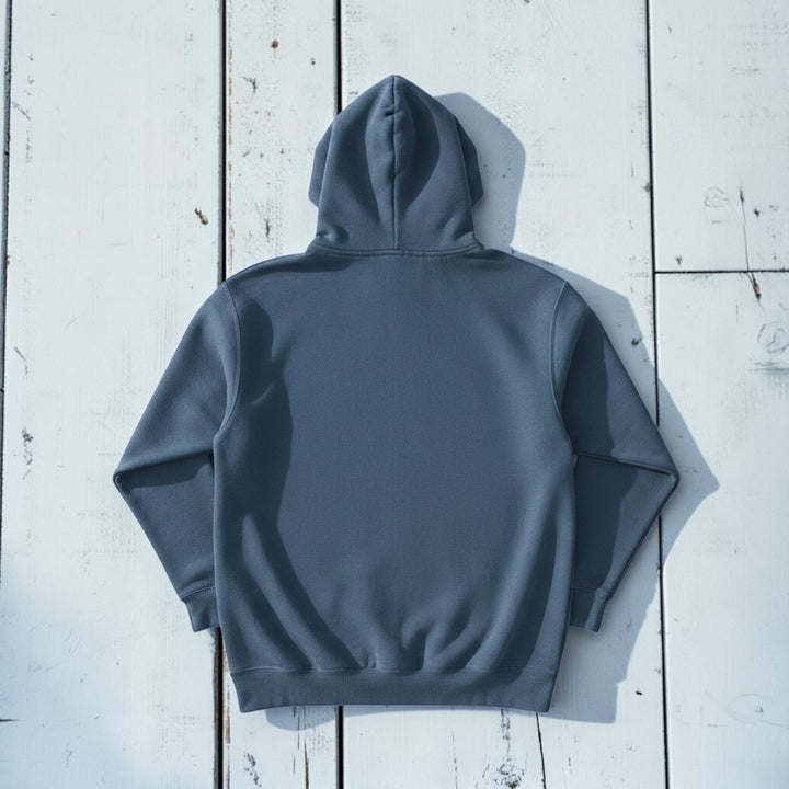 Saltwater Surf Club Hoodie in Denim — plain back, warm sand studio background