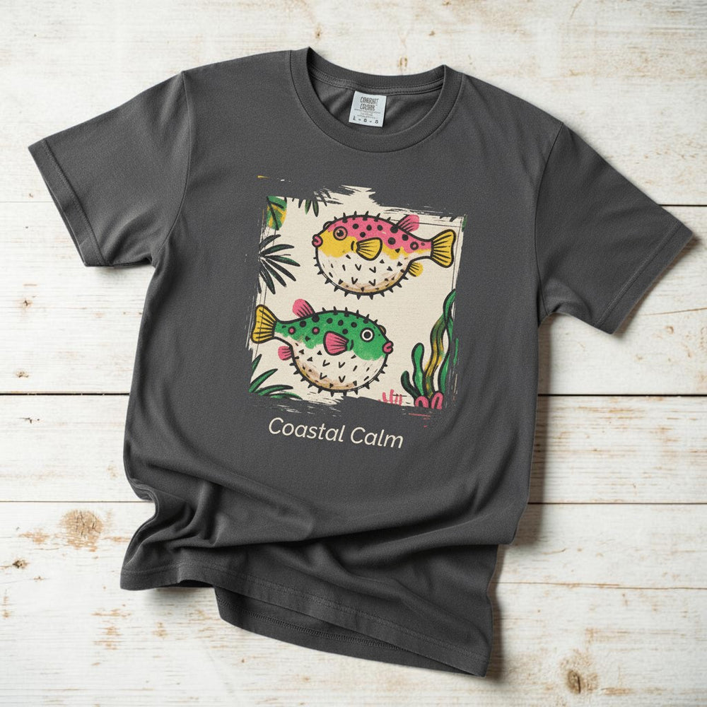 Coastal Calm Pufferfish graphite garment-dyed tee on faded driftwood planks