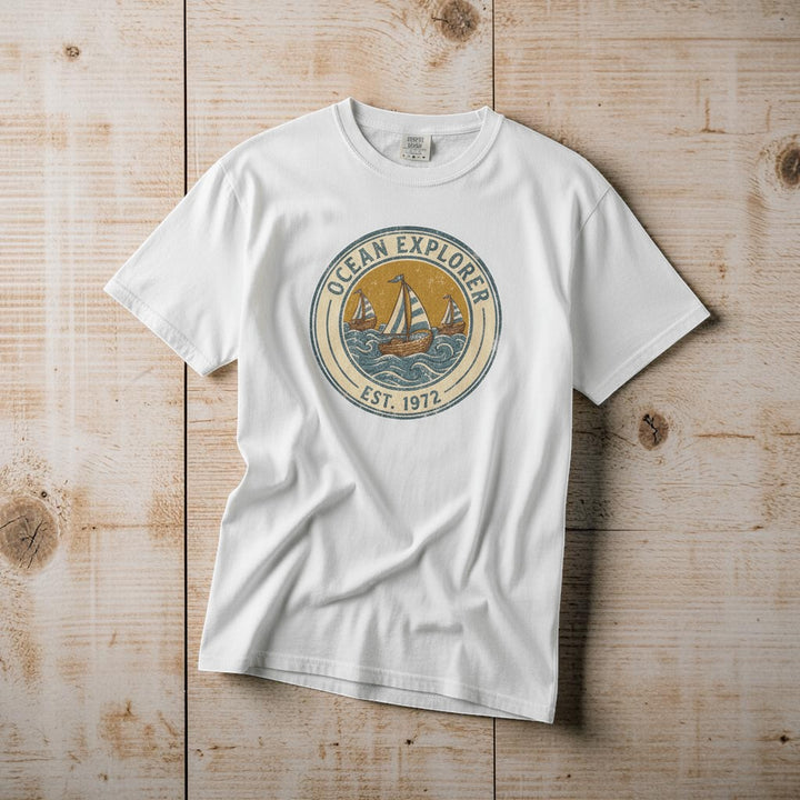 Ocean Explorer white garment-dyed tee casually tousled on rustic reclaimed wood
